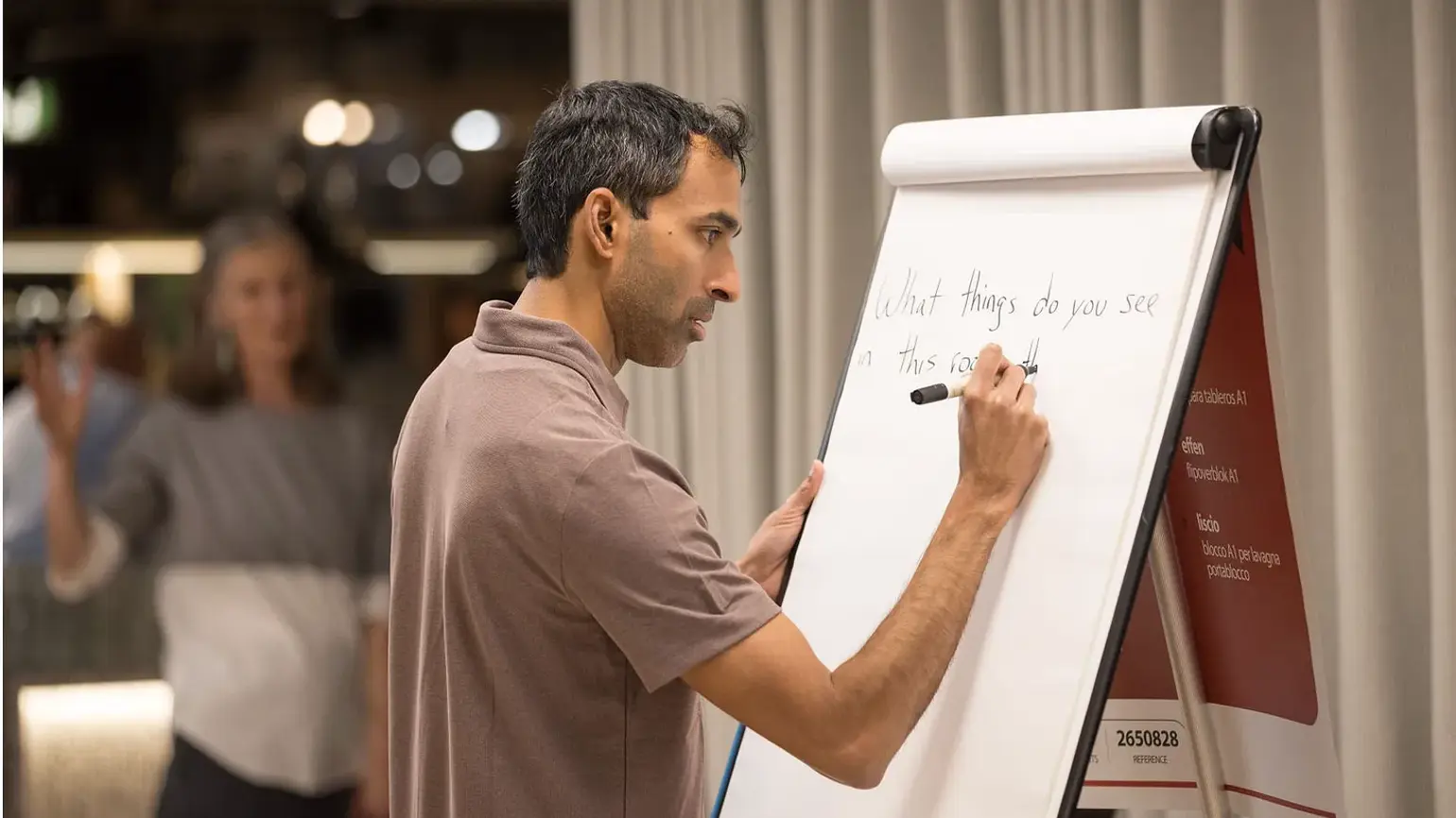 Suraj Bramhavar writing on a whiteboard