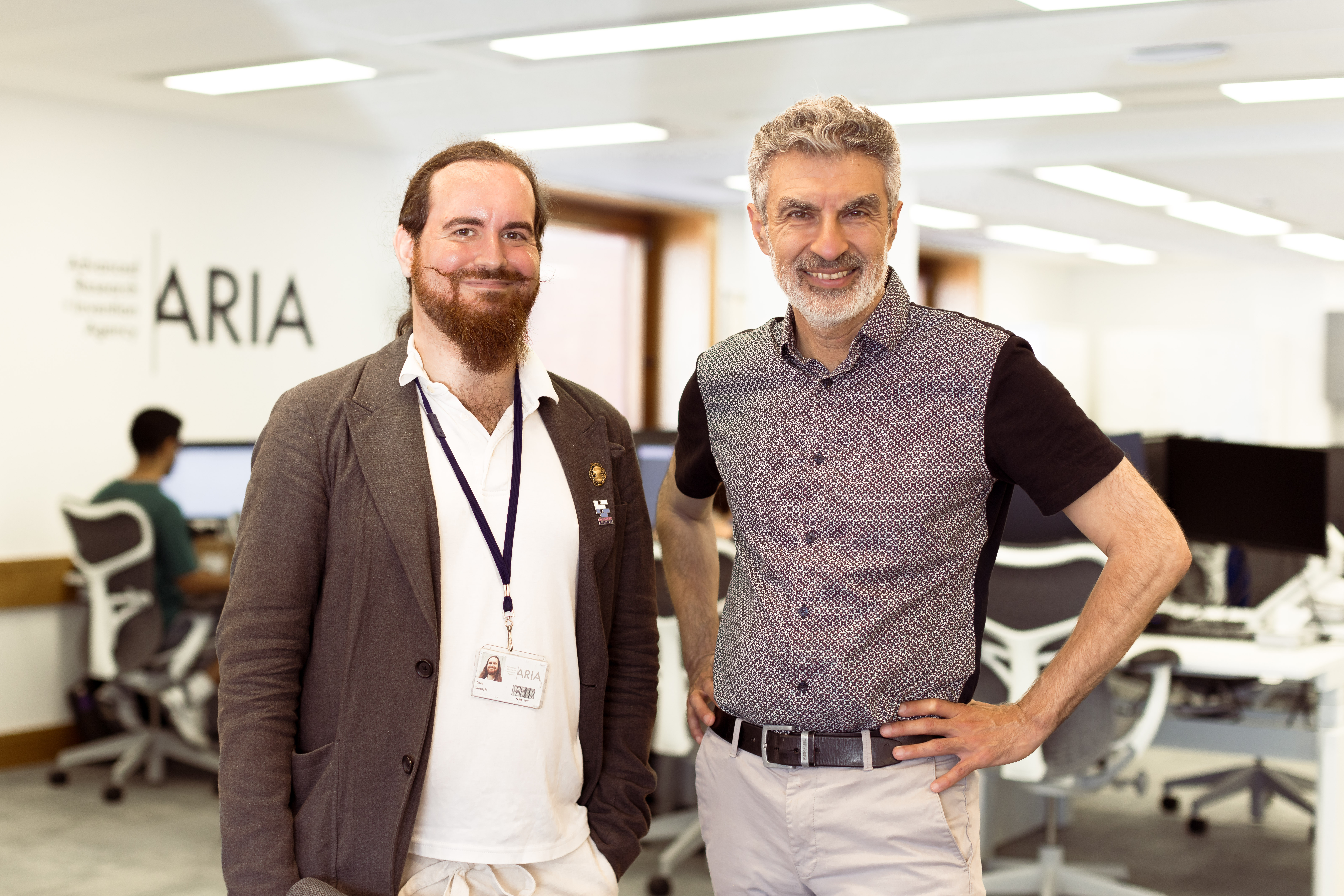 A photo of Yoshua Bengio and David 'davidad' Dalyrmple smiling for the camera.